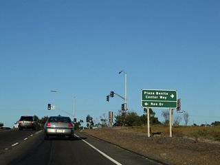 On on the off-ramp for Exit 3, turn left to follow Reo Drive north or turn right to follow Plaza Bonita Center Way south to Sweetwater Road.