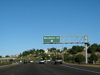 Eastbound California 54 reaches Exit 4, Woodman Street. Woodman Street only heads north into Paradise Hills.