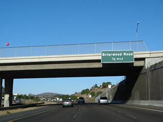 The next exit along eastbound California 54 is Exit 5, Briarwood Road, one-half mile (the sign is posted on the Woodman Street overpass). This exit leads north into Paradise Hills and south into central Bonita.