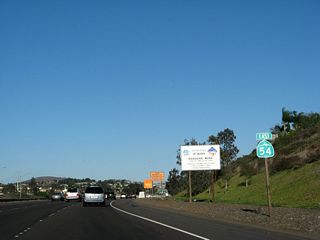 Another California 54 reassurance shield is posted between Woodman Street and Briarwood Road.