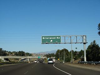 Eastbound California 54 (Filipino-American Highway) reaches Exit 5, Briarwood Road.
