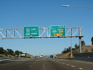 The right lane of California 54 (Filipino-American Highway) east drops at Exit 6 for California 125 south.