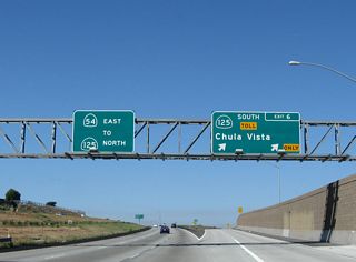 Eastbound California 54 (Filipino-American Highway) reaches Exit 6 for SR 125 (South Bay Expressway) south to Chula Vista and the International Border. The left three lanes continue east to California 125 north.