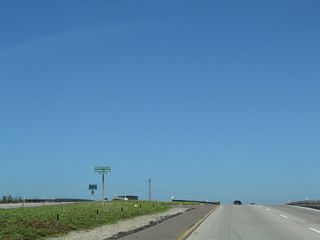 The bridge that carries California 54 west to Interstate 5 south (via Exit 1A) is designated the George R. Volland Memorial Bridge.