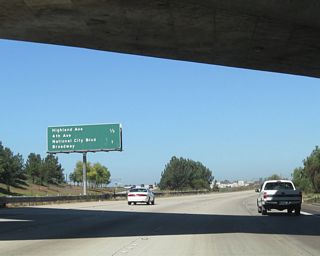 As we leave the Interstate 805 interchange, this mileage sign along California 54 west provides the distance to the final two exits that serve local streets: Exit 1D, Highland Avenue north and Fourth Avenue south and Exit 1C, Historic U.S. 101/Broadway south and National City Boulevard north.