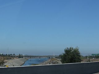 The Sweetwater River, which has paralleled California 54 since the California 125 through the community of Bonita, finds its way into the median of the California 54 freeway. The eastbound lanes stay on the southern bank of the river, while the westbound lanes take the northern bank. The river flows west into San Diego Bay.