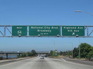 Westbound California 54 reaches Exit 1D, Highland Avenue north to National City and Fourth Avenue south to Chula Vista.