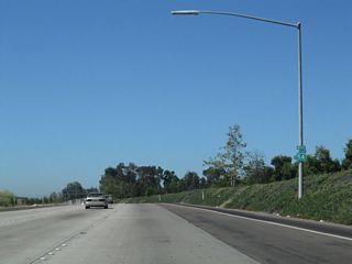 A California 54 west reassurance shield is posted after the Briarwood Road interchange.