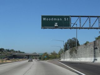 Westbound California 54 reaches Exit 4, Woodman Street north to Paradise Hills. This interchange serves as the southern terminus of Woodman Street.