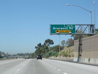 The new right lane of California 54 west becomes exit only for Exit 5, Briarwood Road. This exit serves the unincorporated community of Bonita.