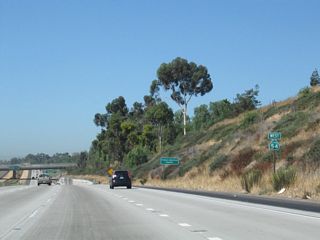 A California 54 west reassurance shield is posted prior to the off-ramp to Exit 5, Briarwood Road to Bonita.