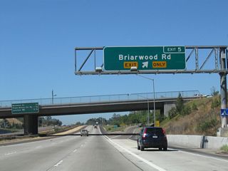 Westbound California 54 (Filipino-American Highway) reaches Exit 5, Briarwood Road to Bonita (south) and the Paradise Hills community of San Diego (north).