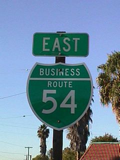 SR 54 Business reassurance marker posted along Jamacha Road north of E Washington Avenue in El Cajon. The business route angles northwest from Washington Avenue onto N 2nd Street at E Main Street (Business Loop I-8).