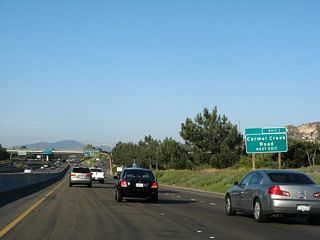 An exit number roadside sign was posted around 2006 for Exit 1, Carmel Creek Road.