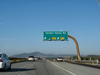 Eastbound California 56 (Ted Williams Freeway) reaches Exit 3, Carmel Valley Road (and future Camino Santa Fe). The next exit is Exit 6, Camino del Sur. Ahead is the longest stretch of California 56 without an exit.