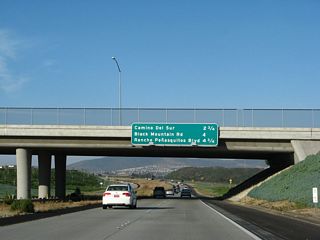 This mileage sign provides the distance to the next three exits along California 56 (Ted Williams Freeway) east: Exit 6, Camino del Sur; Exit 7, Black Mountain Road; and Exit 8, Rancho Penasquitos Boulevard.