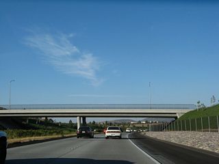 California 56 passes under Rancho Santa Fe Farms Road; there is no access to this road from the freeway. After this overpass, California 56 will leave the community of Pacific Highlands Ranch and enter Torrey Highlands.