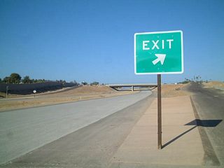 The new freeway was built with concrete roadways, and it features sound walls separating SR 56 from nearby houses.
