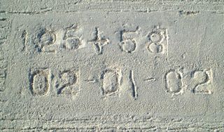 Date stamp showing the concrete for SR 56 was poured on February 1, 2002.