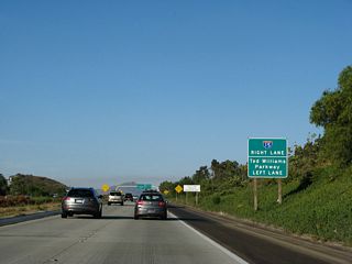 The interchange between California 56 and Interstate 15 is not a freeway-to-freeway interchange. The interchange has two traffic signals, with the first ramp  connecting to Interstate 15 south and the second ramp  connecting to Interstate 15 north. The left two lanes will continue east onto Ted Williams Parkway.