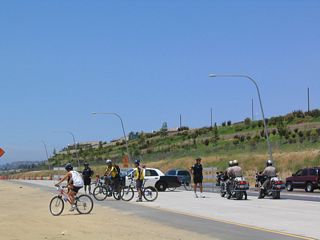 City of San Diego police and the California Highway Patrol ensured that bicyclists and pedestrians not continue west on California 56, as the rest of the freeway west of here was open on this day and not open for previewing.