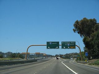 Westbound California 56 reaches Exit 1B, El Camino Real and Carmel Valley Road west to Interstate 5 north.