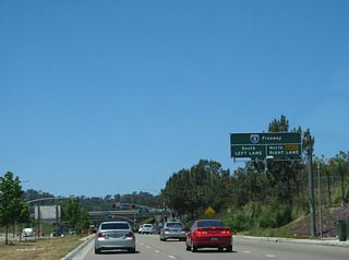 After the El Camino Real intersection, an overhead sign announces the junction with Interstate 5. The first right (after the Old El Camino Real intersection) connects to Interstate 5 north, and the first left connects to Interstate south.