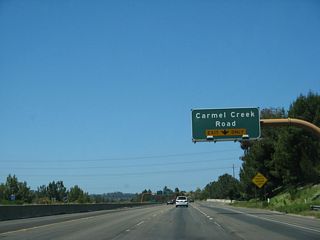 The right lane of California 56 west becomes exit only for Exit 1C, Carmel Creek Road.