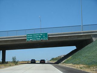 The next three exits along California 56 (Ted Williams Freeway) west are: Exit 2, Carmel Country Road; Exit 1C, Carmel Creek Road; and Exit 1B, El Camino Real to Interstate 5 north.