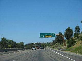 A new right lane forms for the connection from California 56 (Ted Williams Freeway) west to Exit 2, Carmel Country Road.