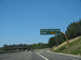 Westbound California 56 (Ted Williams Freeway) reaches Exit 2, Carmel Country Road north to Carmel Valley and south to Carmel Country Highlands and Torrey Hills.