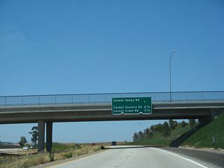 The next three exits along California 56 (Ted Williams Freeway) west are: Exit 3, Carmel Valley Road; Exit 2, Carmel Country Road; and Exit 1C, Carmel Creek Road.