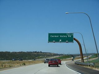 Westbound California 56 (Ted Williams Freeway) reaches Exit 3, Carmel Valley Road.
