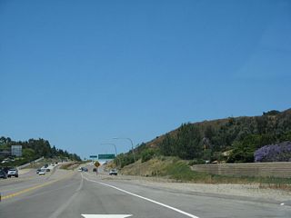 Mainline California 56 west reduces to one through lane after the Interstate 15 south transition ramp. Two new lanes will merge onto the nascent freeway from Interstate 15 south.