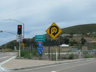 A freeway entrance shield for Interstate 15 south is posted on California 56 west. As noted earlier, the route marker lacks the state name (is neutered).