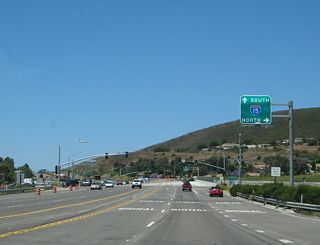 Use Interstate 15 north to Rancho Bernardo, the city of Escondido, and all points north in Riverside and San Bernardino Counties. A loop ramp ahead connects to Interstate 15 south.