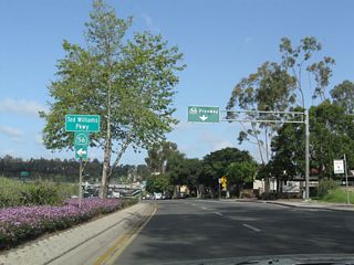 Northbound Penasquitos Boulevard approaches California 56/Ted Williams Parkway. The first left connects to California 56 east via a loop ramp, and the second left links to California 56 west.