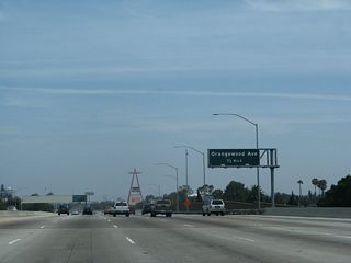 Angel Stadium, with its distinctive Red "A" visible from California 57, is visible to the left of the freeway in the distance.