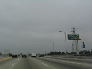 Northbound California 57 (Orange Freeway) reaches Exit 2, Katella Avenue.
