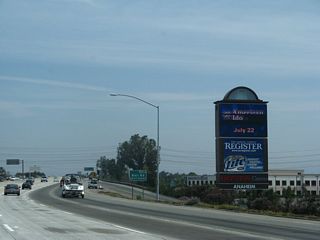 Exit 3 is identified with a single roadside sign located next to a towering marquee with a list of events at the Pond.
