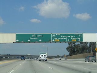 Northbound California 57 (Orange Freeway) reaches the off-ramp for Exit 5A, California 91 (Riverside Freeway) east to Riverside and San Bernardino. The next ramp is for Exit 5B, California 91 west to Redondo Beach.