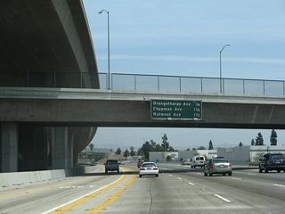 This mileage sign provides the distance along SR 57 north for the next three exits: Exit 6A, Orangethorpe Avenue; Exit 6B, Chapman Avenue; and Exit 7, Nutwood Avenue.
