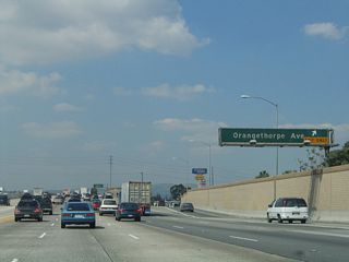 Northbound California 57 (Orange Freeway) reaches Exit 6A, Orangethorpe Avenue.
