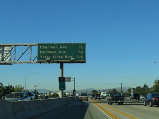 The next three exits along northbound California 57 are Exit 6B, Chapman Avenue; Exit 7, Nutwood Avenue; and Exit 8, Yorba Linda Boulevard.