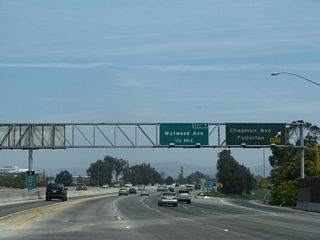 Northbound California 57 reaches Exit 6B, Chapman Avenue in Fullerton. The next exit is Exit 7, Nutwood Avenue. The guide sign for Exit 7 was replaced between 2004 and 2005.