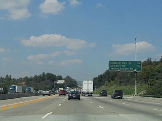 The next three exits along California 57 (Orange Freeway) north are Exit 9, California 90 (Imperial Highway); Exit 10, Lambert Road; and Exit 11, Tonner Canyon Road. This is another sign along California 57 that dates back to the original freeway construction, and it also looks that old.