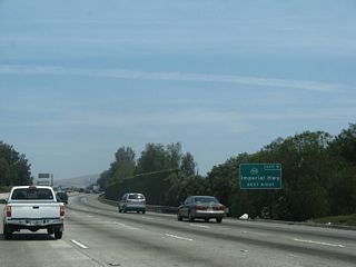 Northbound California 57 approaches Exit 9, California 90 (Imperial Highway), next right.