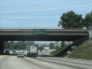 Upon passing under California 90, northbound California 57 (Orange Freeway) departs the city of Fullerton and enters the city of Brea. The next exit along northbound is Exit 10, Lambert Road. The city of Brea was incorporated on February 23, 1917.