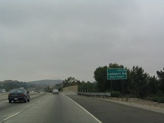 Another new, roadside exit number sign is found in advance of Lambert Road. Use Lambert Road east to reach Carbon Canyon Road/California 142. California 142 passes through Carbon Canyon en route to Sleepy Hollow before reaching Chino Hills in San Bernardino County.