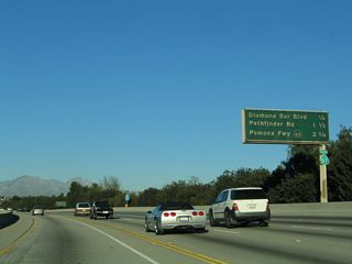 This mileage sign provides the distance to the next three exits along California 57 (Orange Freeway) north: Exit 14, Diamond Bar Boulevard; Exit 15, Pathfinder Road, and Exit 16, California 60 (Pomona Freeway) west to Los Angeles. (To California 60 east to Pomona and Riverside, continue along California 57 north as the two routes share alignment for a couple miles through Diamond Bar.) Exit 14 is the first exit upon exiting Brea Canyon.